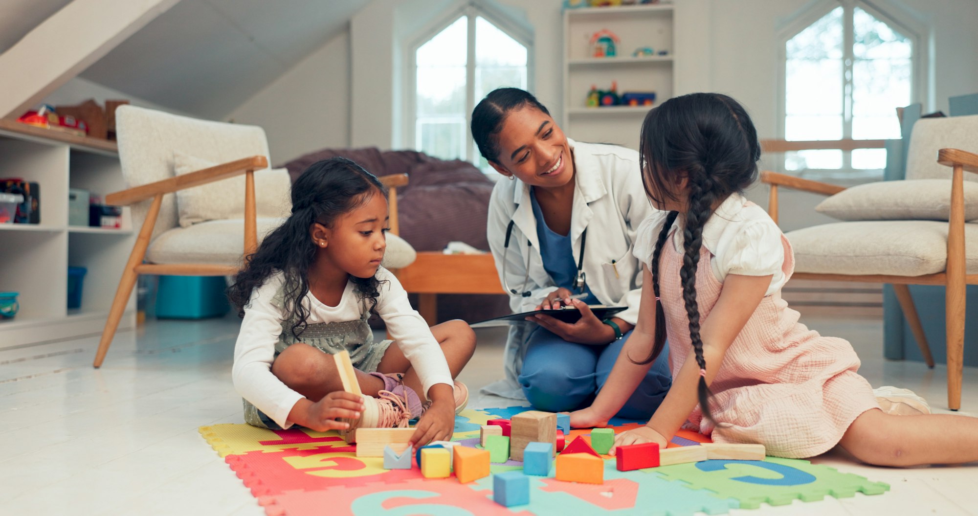 Healthcare, children and therapist for play therapy, session and consultation with little girl. Med